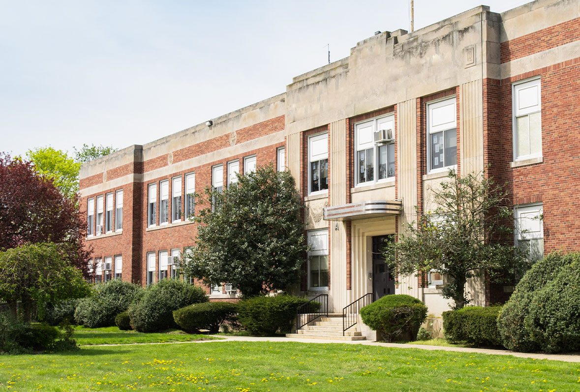 Exterior Photo of Old School in Summer